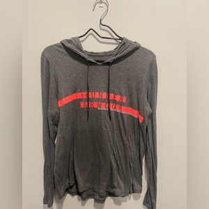 Under Armor long sleeve hooded shirt. Loose fit size Medium.